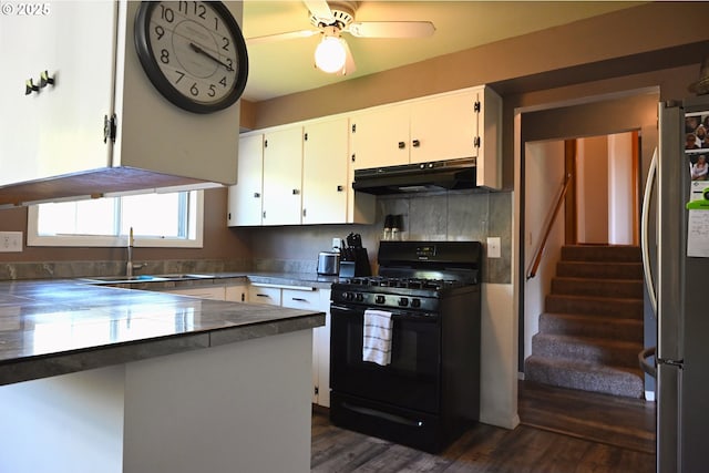 7811 NE 78th St, Vancouver, WA 98662 - kitchen with white cabinets, a sink, freestanding refrigerator, black range with gas stovetop, and under cabinet range hood