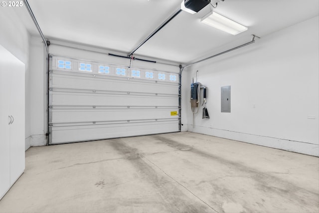 301 Chinook St, Molalla, OR 97038 - garage featuring electric panel, a central vacuum unit, and a garage door opener
