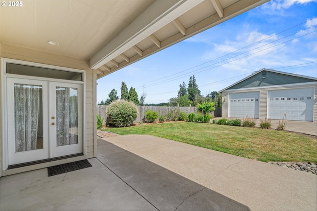 301 Chinook St, Molalla, OR 97038 - view of patio / terrace featuring french doors, an outdoor structure, and a garage