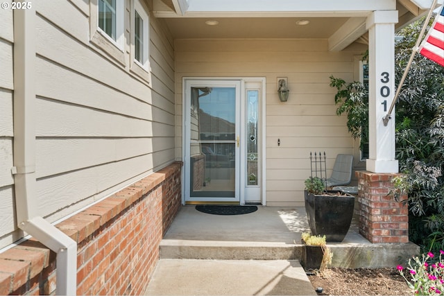 301 Chinook St, Molalla, OR 97038 - doorway to property featuring covered porch