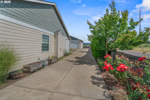 301 Chinook St, Molalla, OR 97038 - view of home's exterior with an outbuilding and a garage