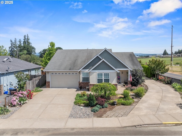 301 Chinook St, Molalla, OR 97038 - craftsman-style house with an attached garage, brick siding, and driveway