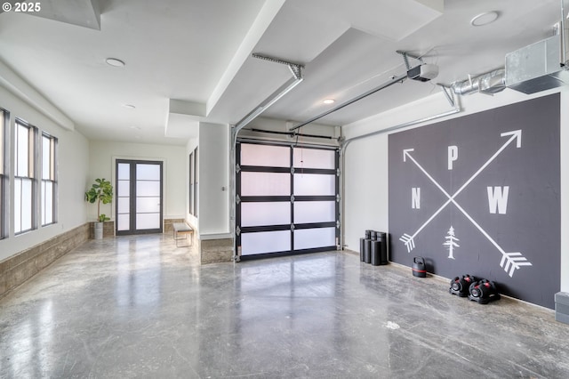 garage featuring baseboards and a garage door opener