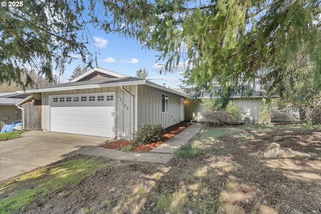 view of front of property featuring a garage, board and batten siding, and driveway