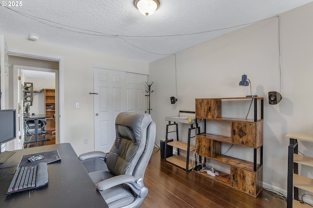 office space with a textured ceiling and wood finished floors