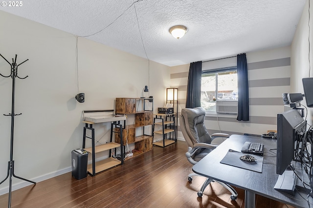 office space with wood finished floors, baseboards, and a textured ceiling