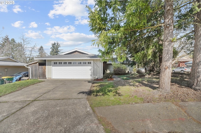 view of front of home featuring driveway and an attached garage