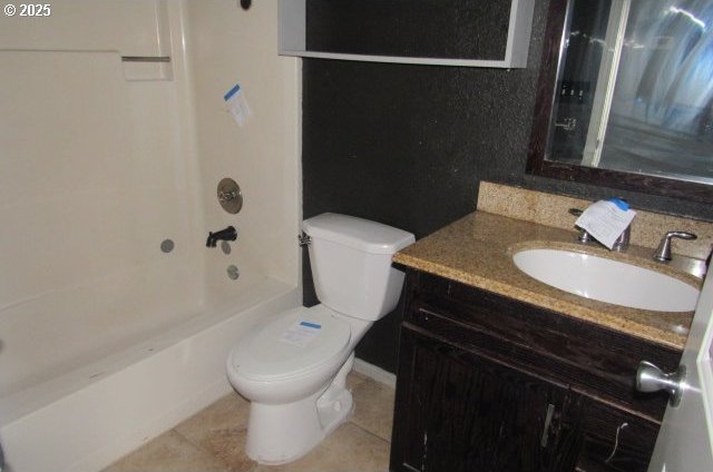 full bathroom featuring tile patterned flooring, vanity,  shower combination, and toilet