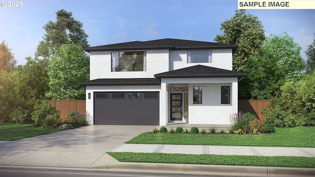 view of front facade with a garage and a front lawn