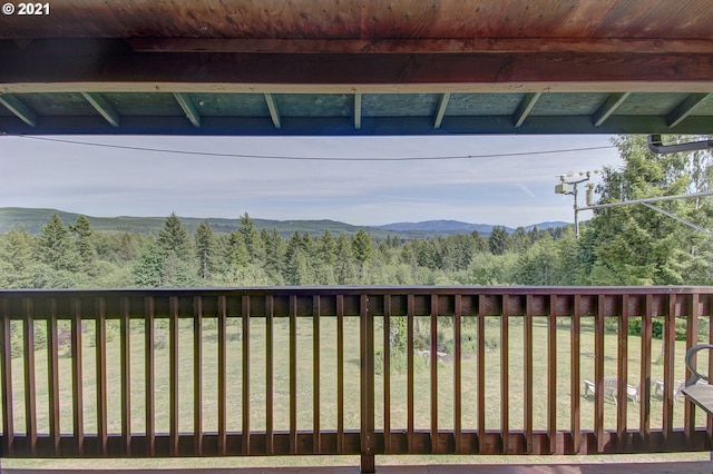 exterior space featuring a mountain view and a view of trees