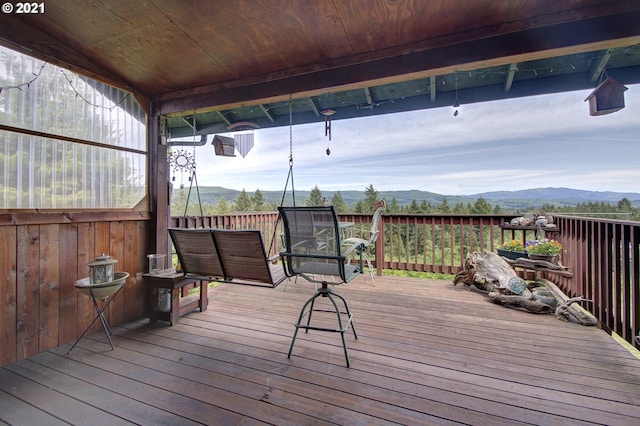 wooden deck featuring a mountain view