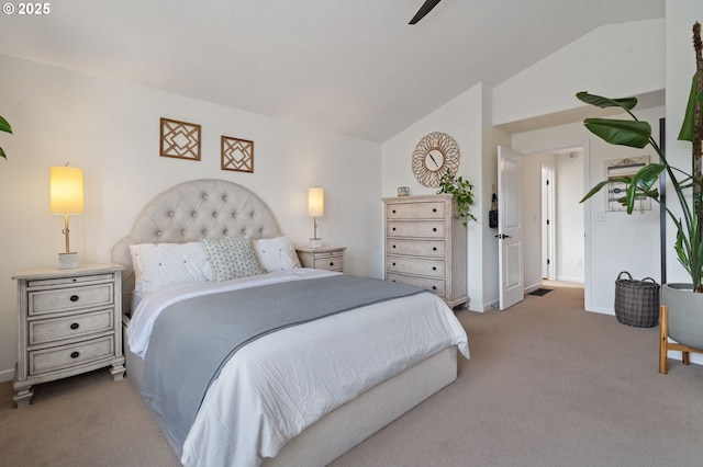 carpeted bedroom featuring vaulted ceiling and ceiling fan