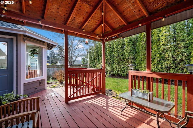 deck with a gazebo and a lawn