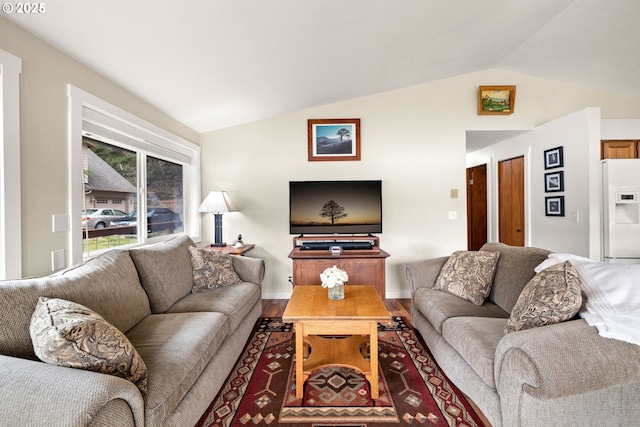 living room with lofted ceiling and wood finished floors