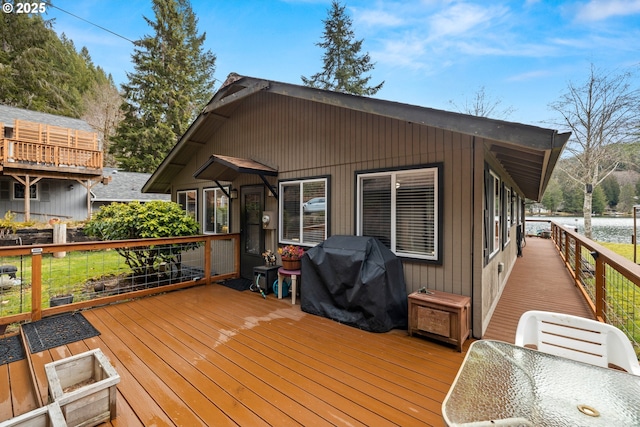 wooden terrace featuring grilling area