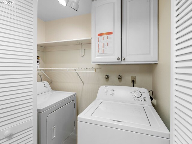 7116 SW Murray Blvd, Beaverton, OR 97008 - washroom featuring washer and clothes dryer and cabinet space
