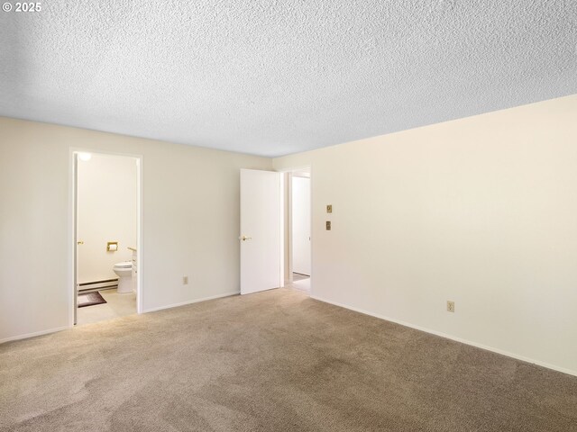 7116 SW Murray Blvd, Beaverton, OR 97008 - spare room with light colored carpet, a baseboard radiator, and a textured ceiling