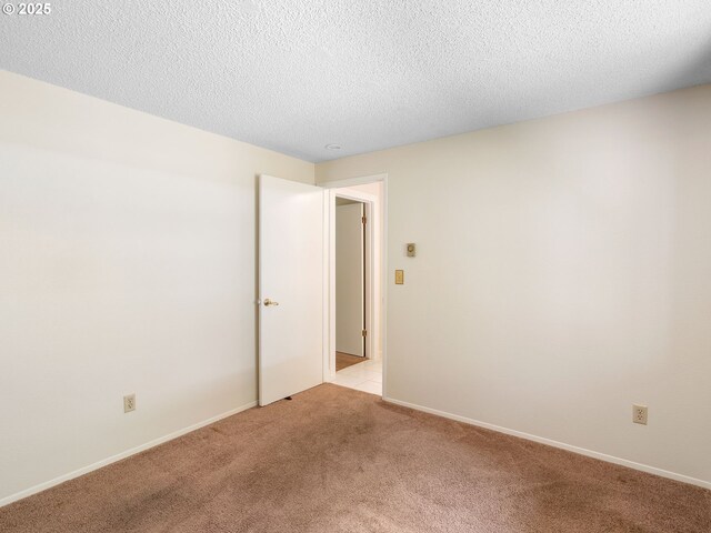 7116 SW Murray Blvd, Beaverton, OR 97008 - spare room with light carpet, a textured ceiling, and baseboards