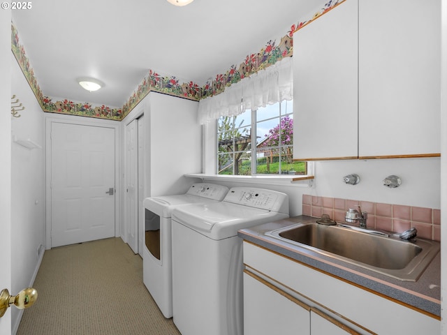 343 Hemlock St, Seaside, OR 97138 - washroom featuring light carpet, a sink, independent washer and dryer, and cabinet space