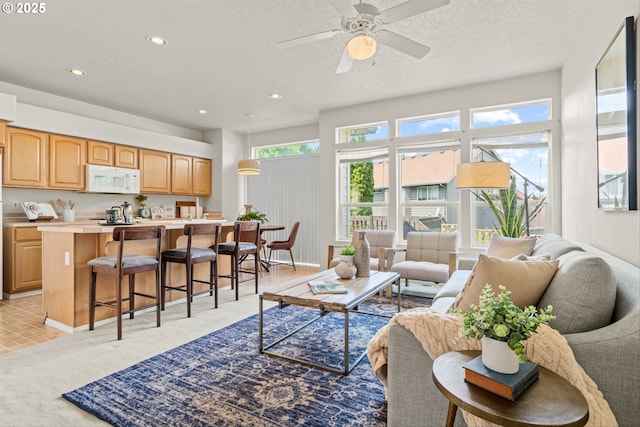 2539 NW 167th Ave, Beaverton, OR 97006 - living room featuring recessed lighting, light colored carpet, a ceiling fan, baseboards, and a textured ceiling