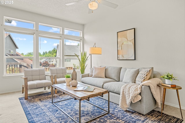 2539 NW 167th Ave, Beaverton, OR 97006 - carpeted living area featuring baseboards, plenty of natural light, a ceiling fan, and a textured ceiling