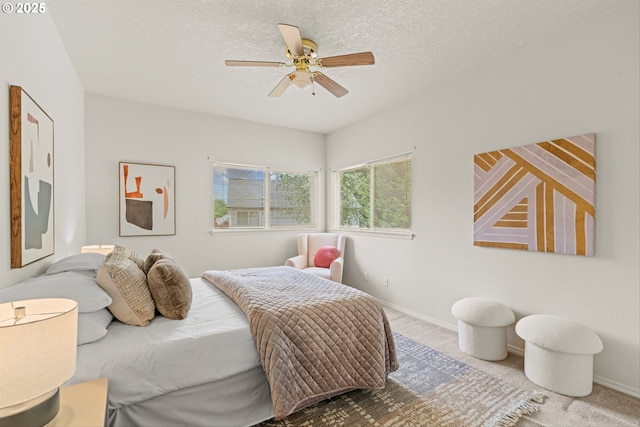2539 NW 167th Ave, Beaverton, OR 97006 - bedroom with a ceiling fan, a textured ceiling, and baseboards