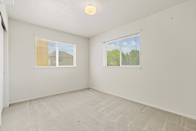 2539 NW 167th Ave, Beaverton, OR 97006 - carpeted empty room with a textured ceiling and baseboards