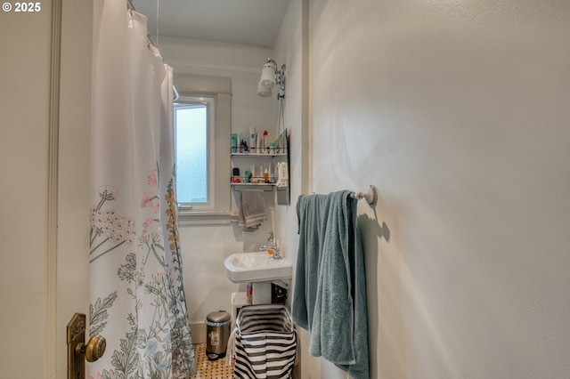 bathroom with a sink and a shower with curtain