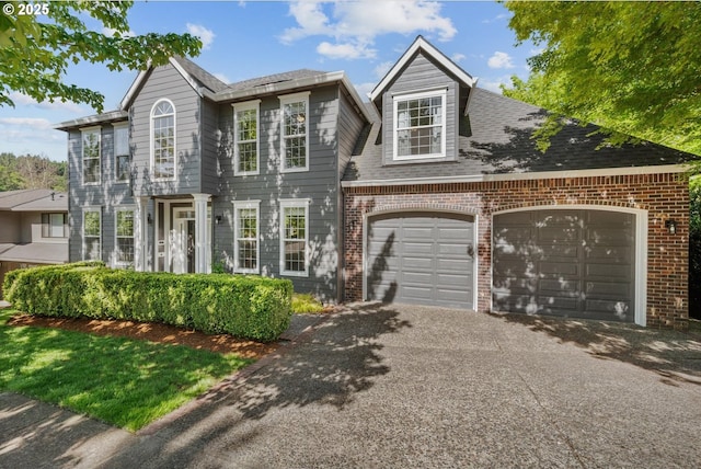 2255 River Heights Cir, West Linn, OR 97068 - view of front facade with brick siding, asphalt driveway, a garage, and a shingled roof