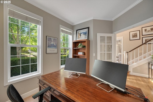 home office featuring baseboards, ornamental molding, and wood finished floors