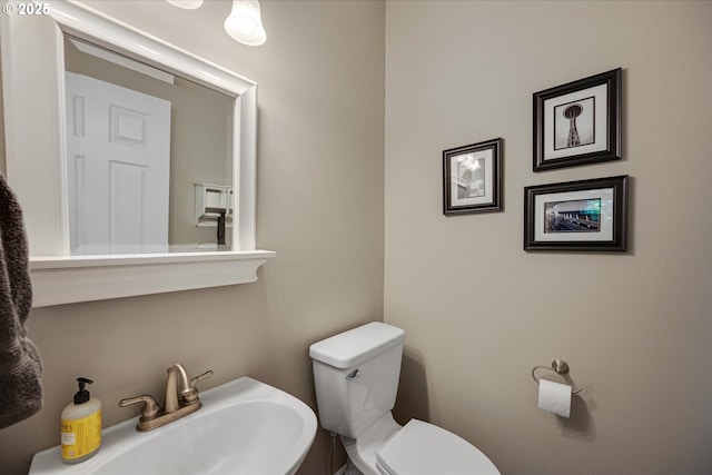 bathroom featuring a sink and toilet