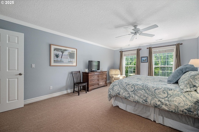 bedroom with carpet flooring, crown molding, a textured ceiling, baseboards, and a ceiling fan