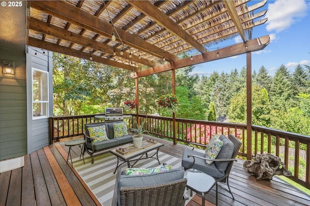 wooden terrace with an outdoor living space, a pergola, and a wooded view