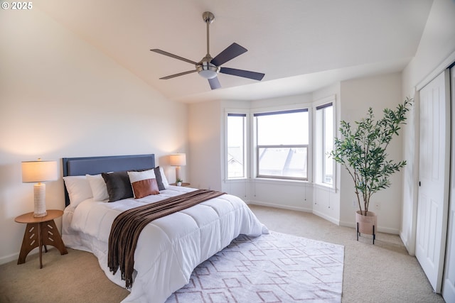 9235 NW Germantown Rd, Portland, OR 97231 - bedroom with light carpet, lofted ceiling, a closet, and a ceiling fan