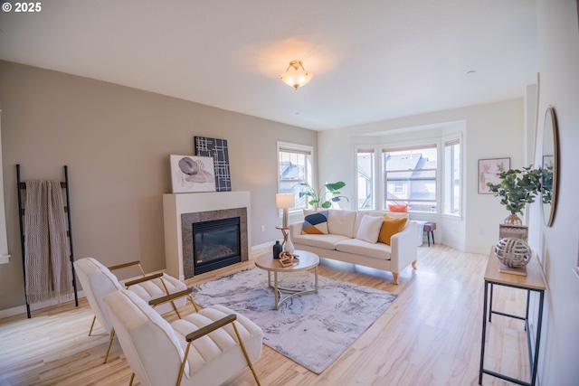 9235 NW Germantown Rd, Portland, OR 97231 - living area featuring healthy amount of natural light, light wood-style flooring, and a glass covered fireplace