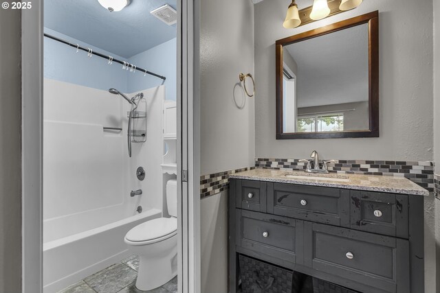 full bath featuring toilet, vanity, bathtub / shower combination, and visible vents