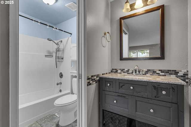 bathroom with visible vents, toilet, vanity, and shower / bathing tub combination