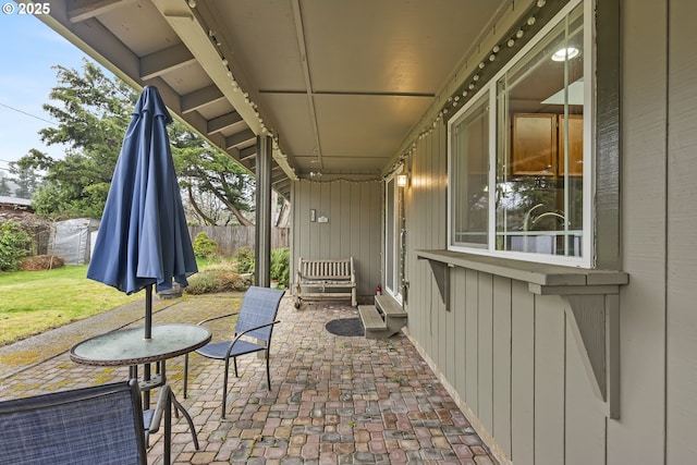 view of patio featuring fence