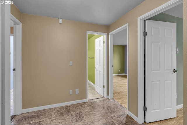 interior space featuring baseboards