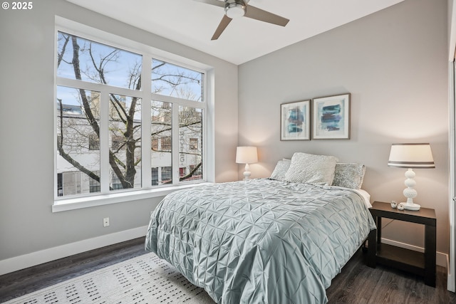 bedroom with dark wood-type flooring and ceiling fan