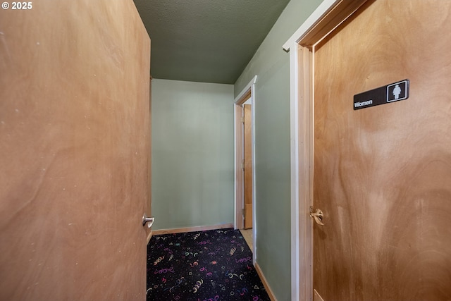 115 8th St, Winchester Bay, OR 97467 - hallway with baseboards and carpet flooring