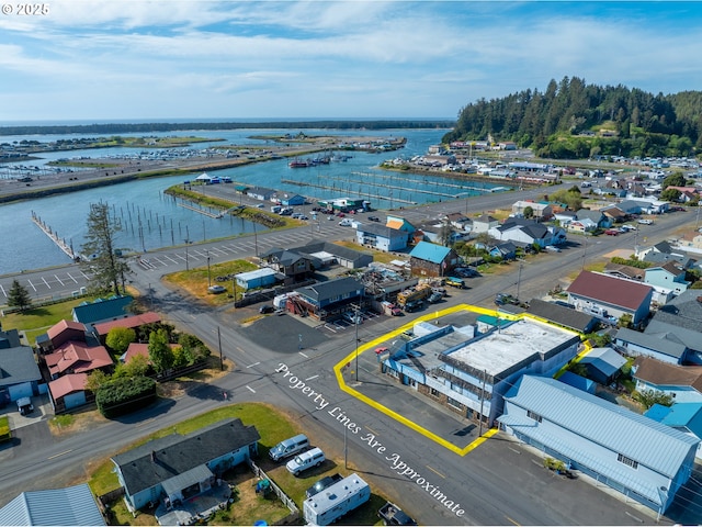 115 8th St, Winchester Bay, OR 97467 - aerial view of property and surrounding area featuring property boundaries highlighted and a large body of water