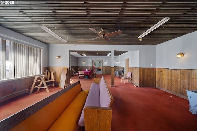 115 8th St, Winchester Bay, OR 97467 - miscellaneous room with wainscoting, a ceiling fan, wood walls, and carpet floors