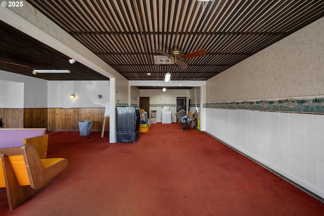 115 8th St, Winchester Bay, OR 97467 - garage featuring a wainscoted wall and ceiling fan