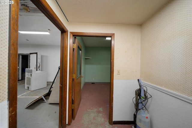 115 8th St, Winchester Bay, OR 97467 - hall with wallpapered walls and concrete flooring