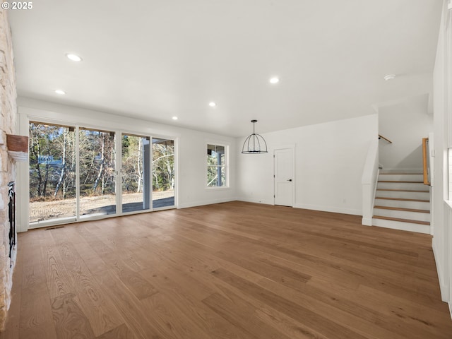 unfurnished living room with hardwood / wood-style floors