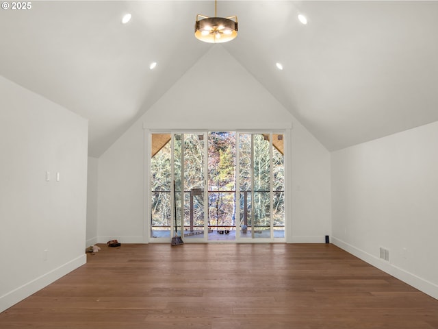 bonus room featuring vaulted ceiling and hardwood / wood-style floors