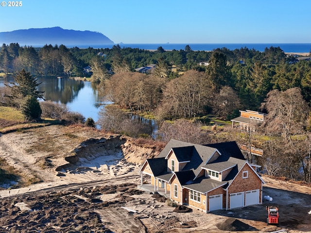 drone / aerial view with a water view