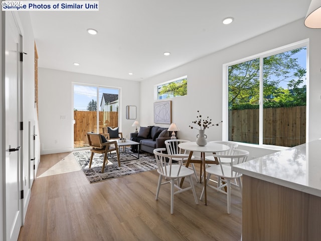 1220 SE Center St Unit 2, Portland, OR 97202 - dining room featuring light wood-style flooring, healthy amount of natural light, and recessed lighting