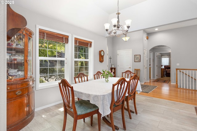 161 Single Pine Ln, Winchester, OR 97495 - dining area featuring arched walkways, a chandelier, and recessed lighting